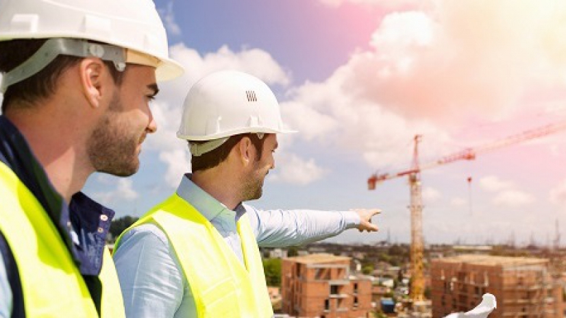 View of a Worker and architect watching some details on a construction