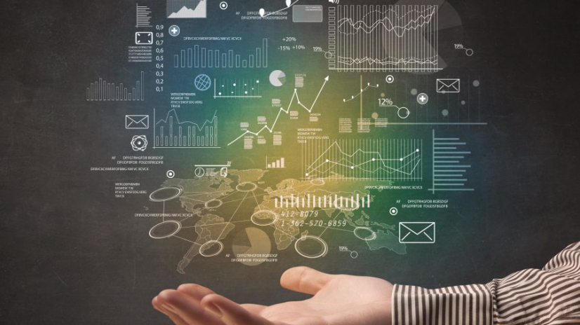 Demographic related charts, diagrams and graphs hovering over young hand