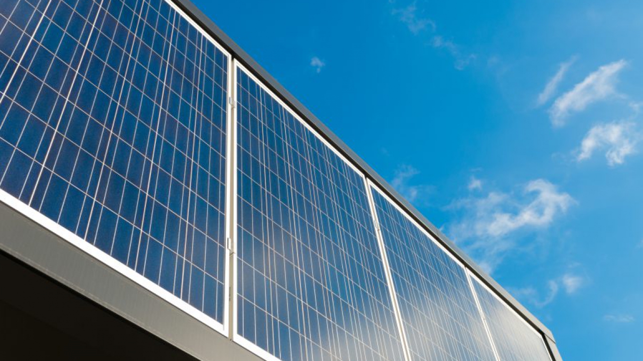 solar panels against a blue sunny sky