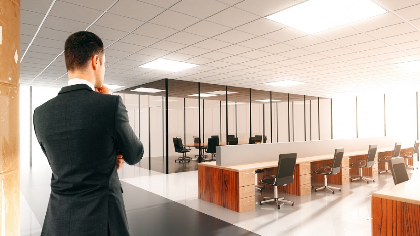 Businessman in the light open space office