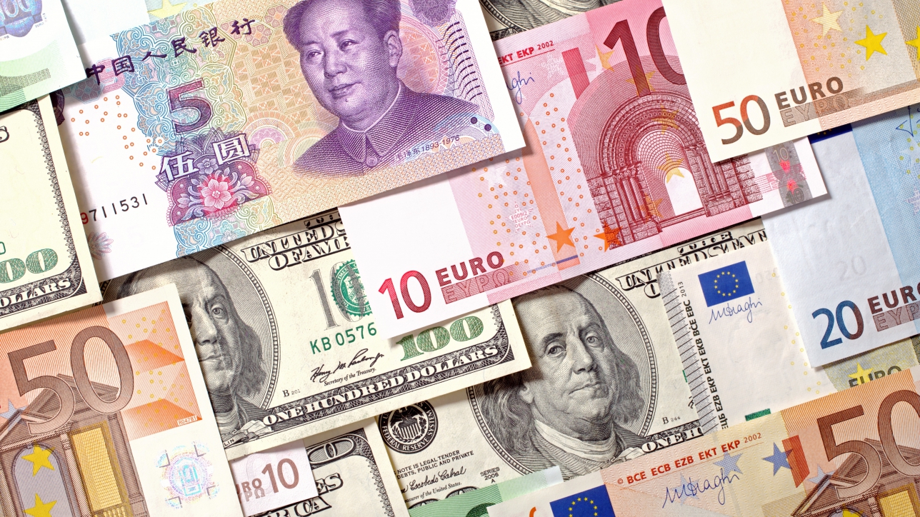 American, European and Chinese banknotes background. Dollars, Euro and Yuan currencies