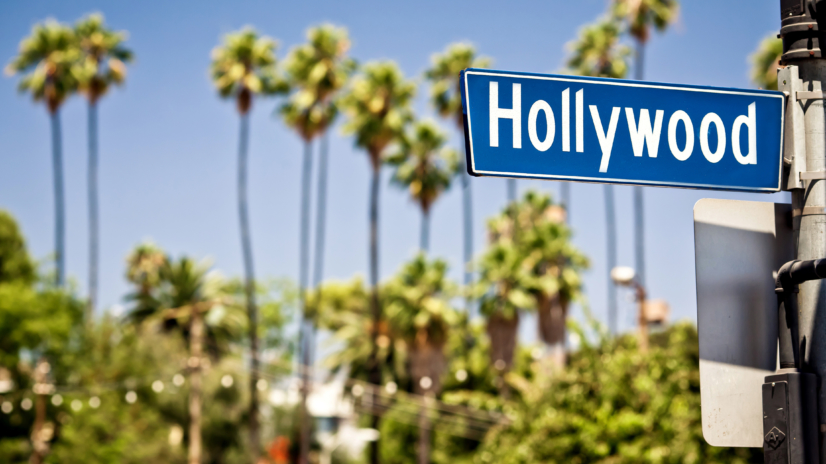 Hollywood boulevard sign, with palm trees in the background